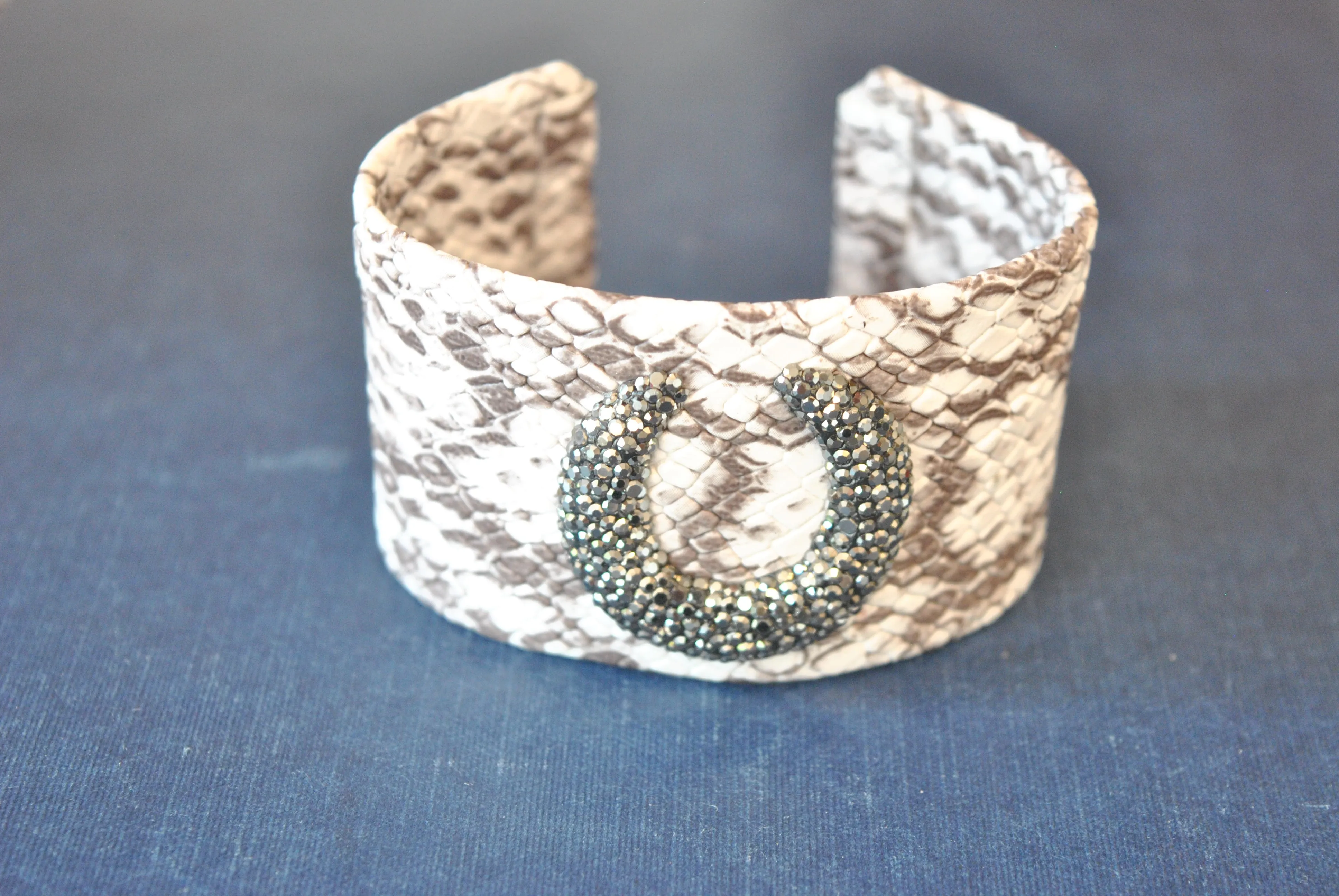 HITE AND TAUPE ECO LEATHER CUFF WITH CRYSTALS
