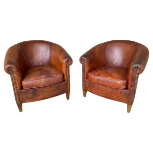 Pair Distressed Vintage European Leather Tub Chairs with Brass Nailhead Detail