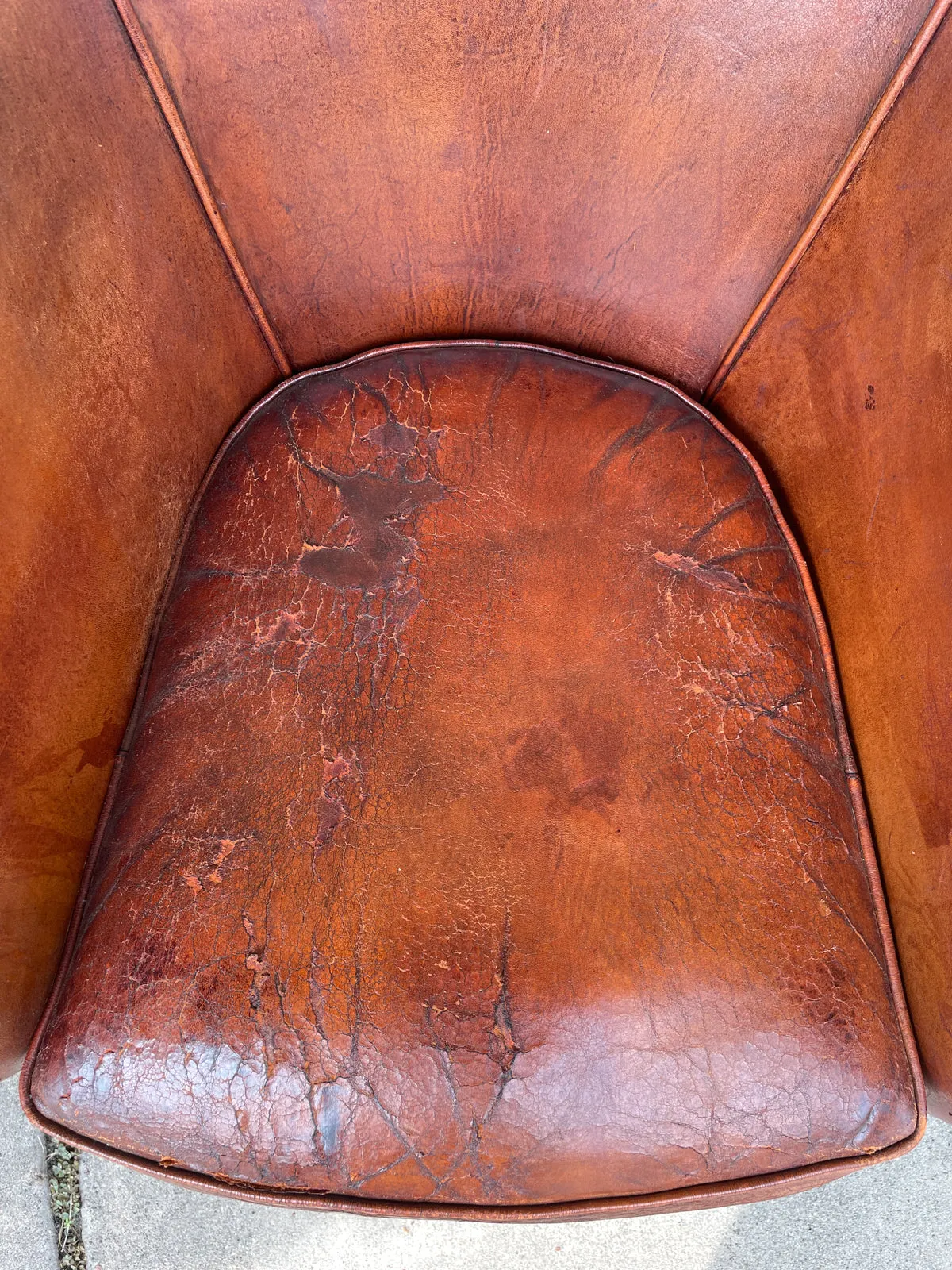Pair Distressed Vintage European Leather Tub Chairs with Brass Nailhead Detail